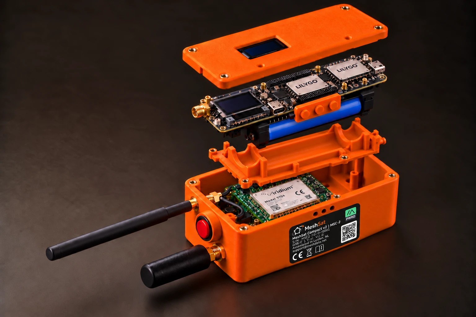 MSC-2 concept with the separated orange lid, the LILYGO board above a cylindrical battery support, the RockBLOCK 9704 in the body, a red button between the antennas and a side label.
